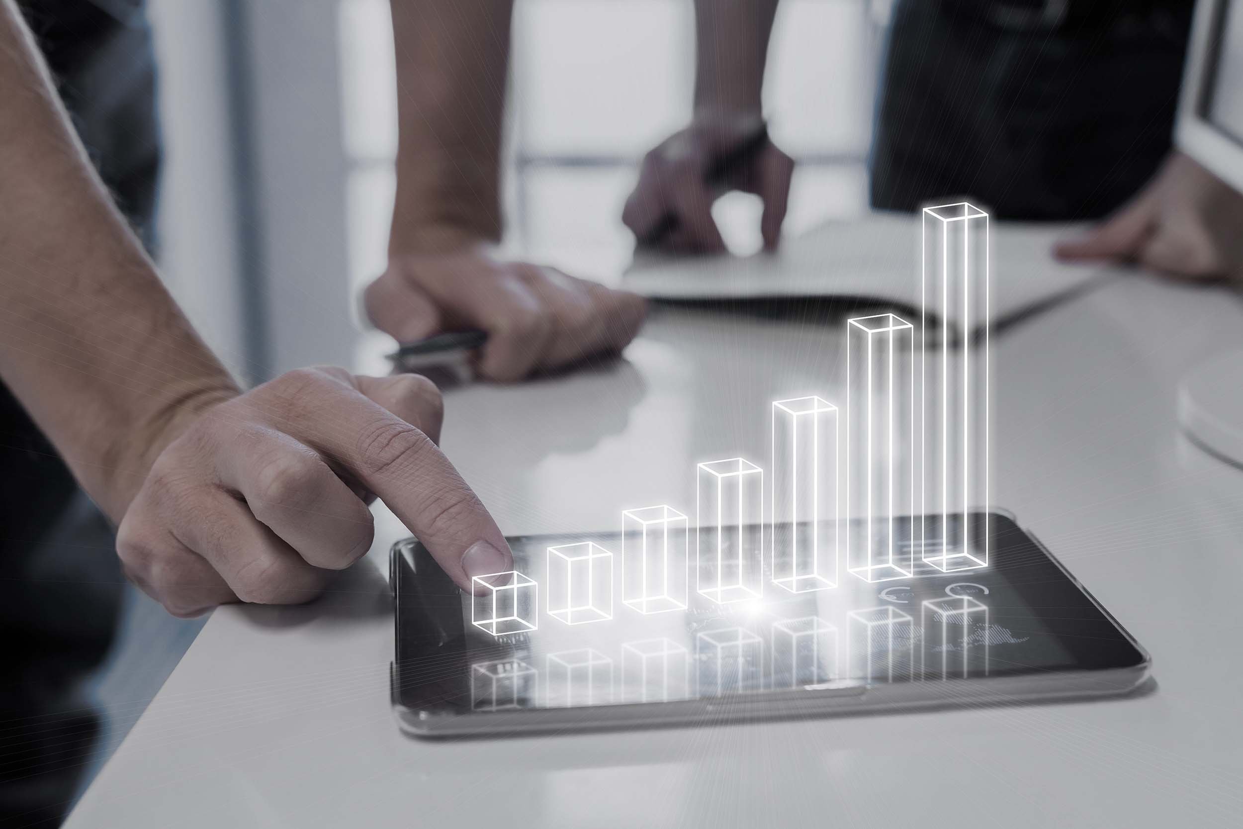Augmented Reality Solutions by Cadesign form - a graph made of a digital projection sits on a table top
